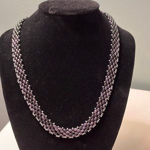 N65. Purple and silver beaded necklace.